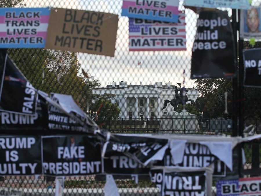 The fence outside the White House is covered with posters and signs on Nov. 15 after celebrations over Biden’s victory and protests over Trump’s recent actions. 