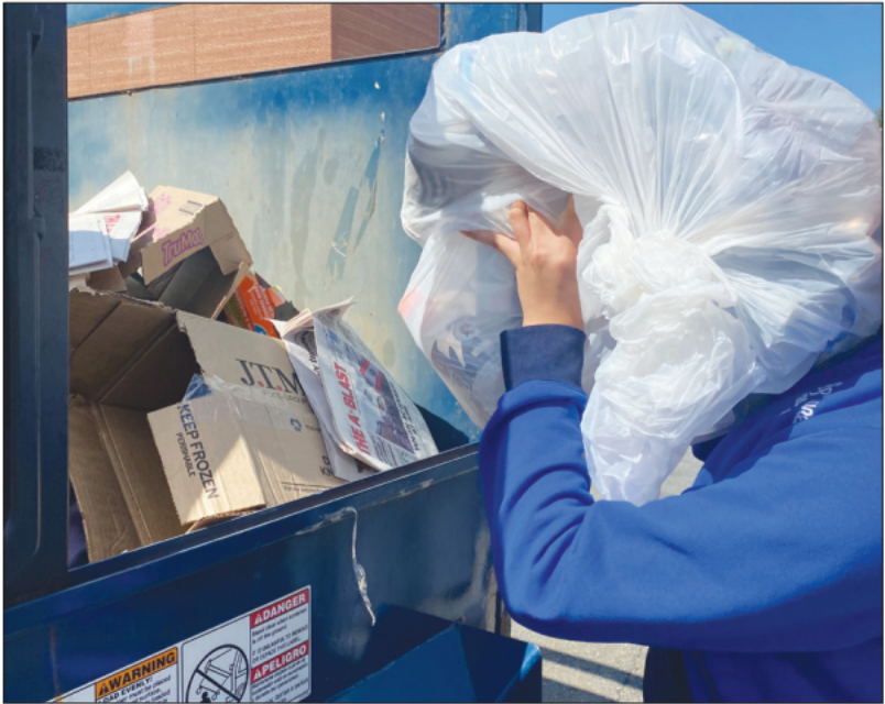 Senior Allan Huynh goes around the school, stopping at each classroom to collect recycling, which is then properly disposed of in the recycling bins outside.