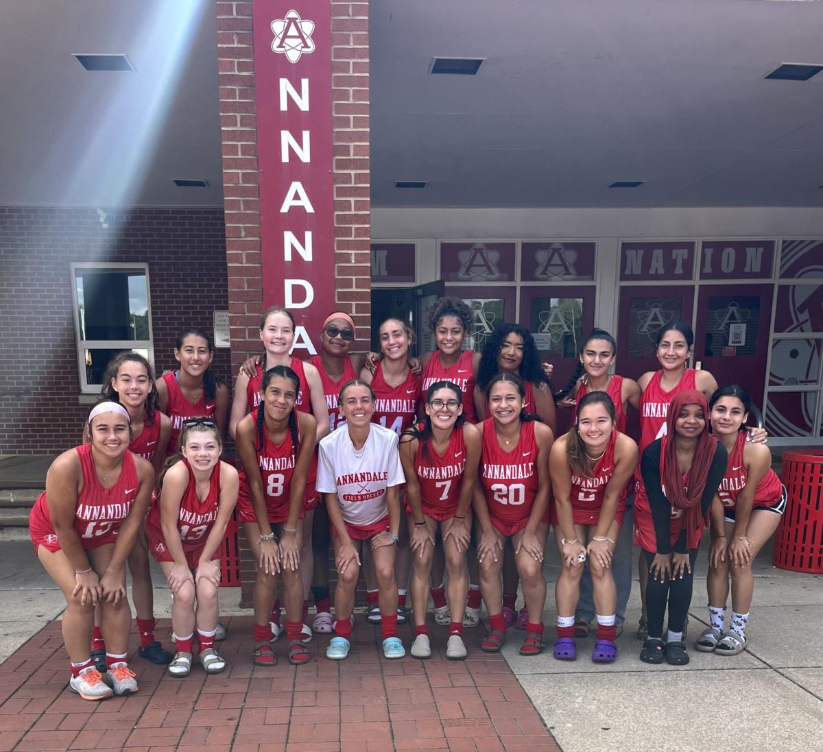 The atoms Field Hockey team takes a team photo before their bus ride to the Langley High School field hockey tournament.