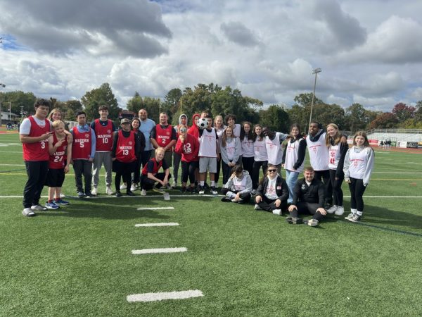 The Atoms Special Olympics team poses for a photo after a team event