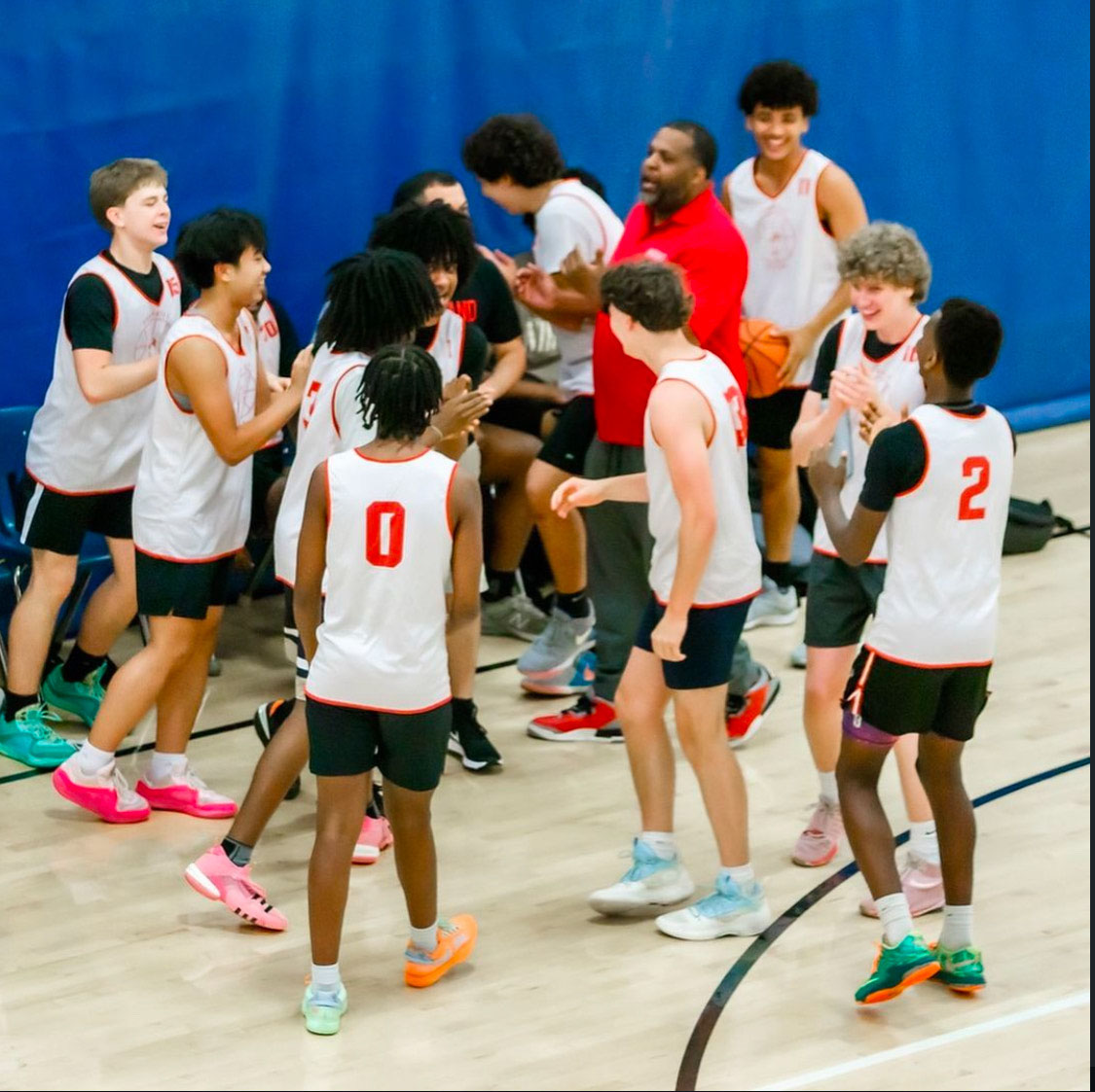 The junior varsity basketball team prepares for their game at Wakefield High School during the 2023 season