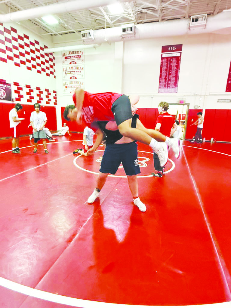 Senior Issac Readinger practices throws for his upcoming scrimmage.