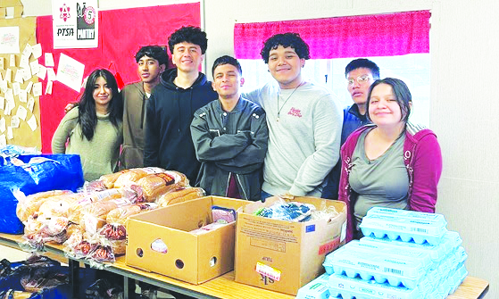 Students work as volunteers with the AHS food pantry to collect and sort donated products to help families in need across the community annually.