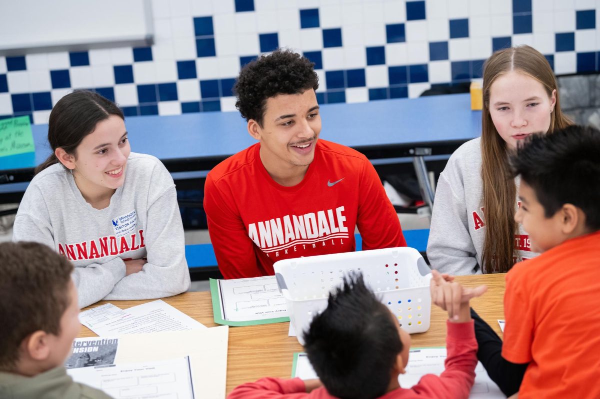 Senior Tyson Perkins and Junior Megan Murray participate in the Readers for Learners program at Braddock Elementary School.