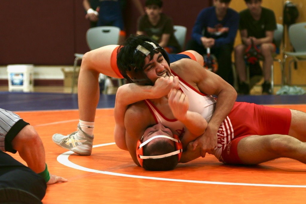 Junior Adam Khaliqi wrestles at Briar Woods High School