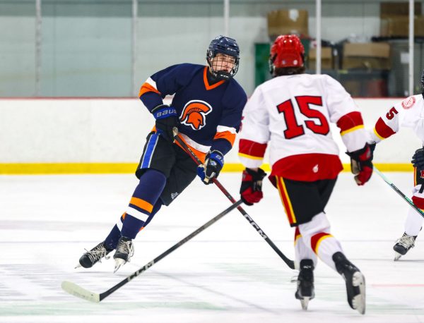 Senior Max Jordan plays in a regular season hockey game